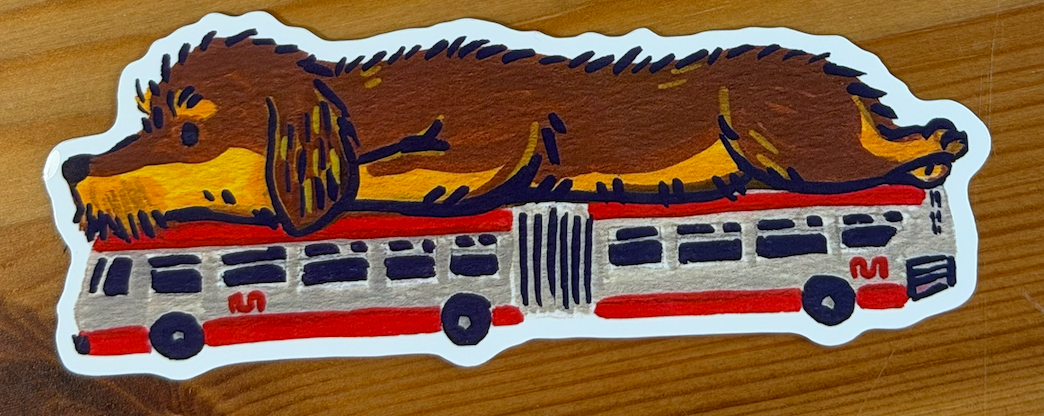 Sticker of a dachshund on a city bus.