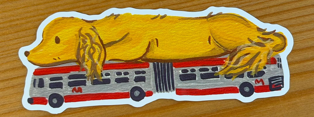 Sticker of a dachshund on a city bus.